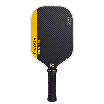 Pikqua Pro Uno pickleball paddle with a black Blue Kevlar pattern face, a bright yellow side accent, and a black wrapped handle, shown on a solid white background.