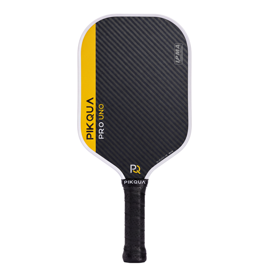 Pikqua Pro Uno pickleball paddle with a black Blue Kevlar pattern face, a bright yellow side accent, and a black wrapped handle, shown on a solid white background.