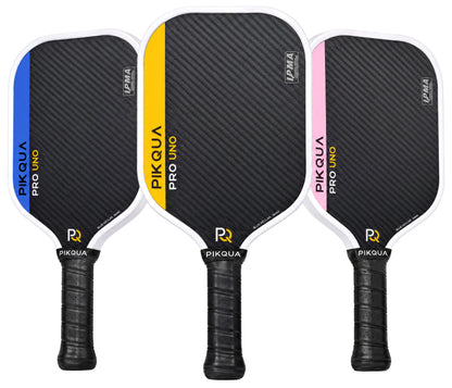Three pickleball paddles from Piqua Pro Uno shown side by side on a white background, featuring a blue kevlar face with white trim and colored accents in blue, yellow, and pink.